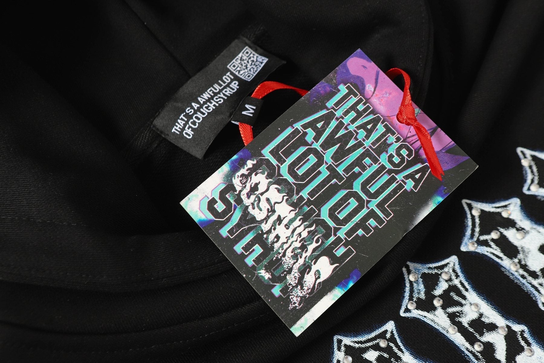THAT'S A AWFUL LOT OF COUGH SYRUP Star Skull Graphic Hoodie — hang_tag
